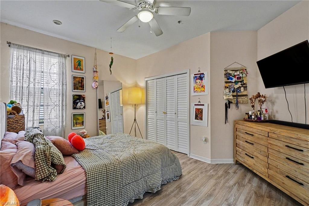 3 Bedroom with light wood-style floors, ceiling fan, and a closet