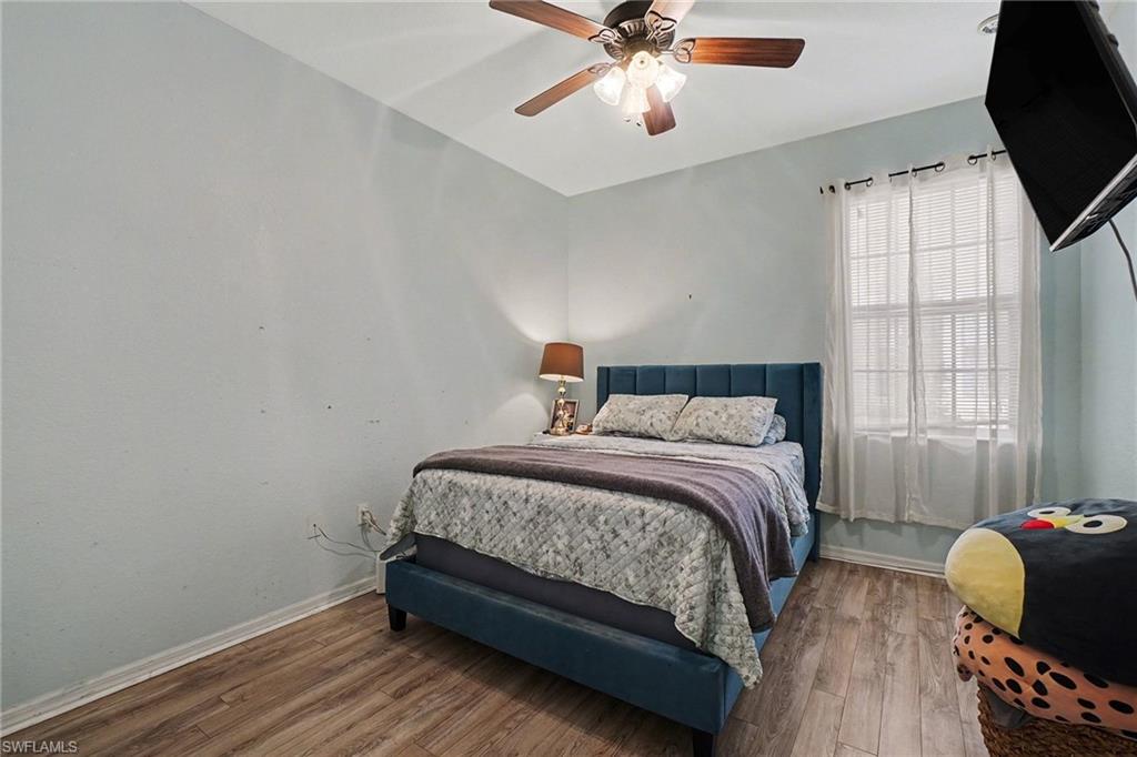 Bedroom 2 featuring wood finished floors and ceiling fan