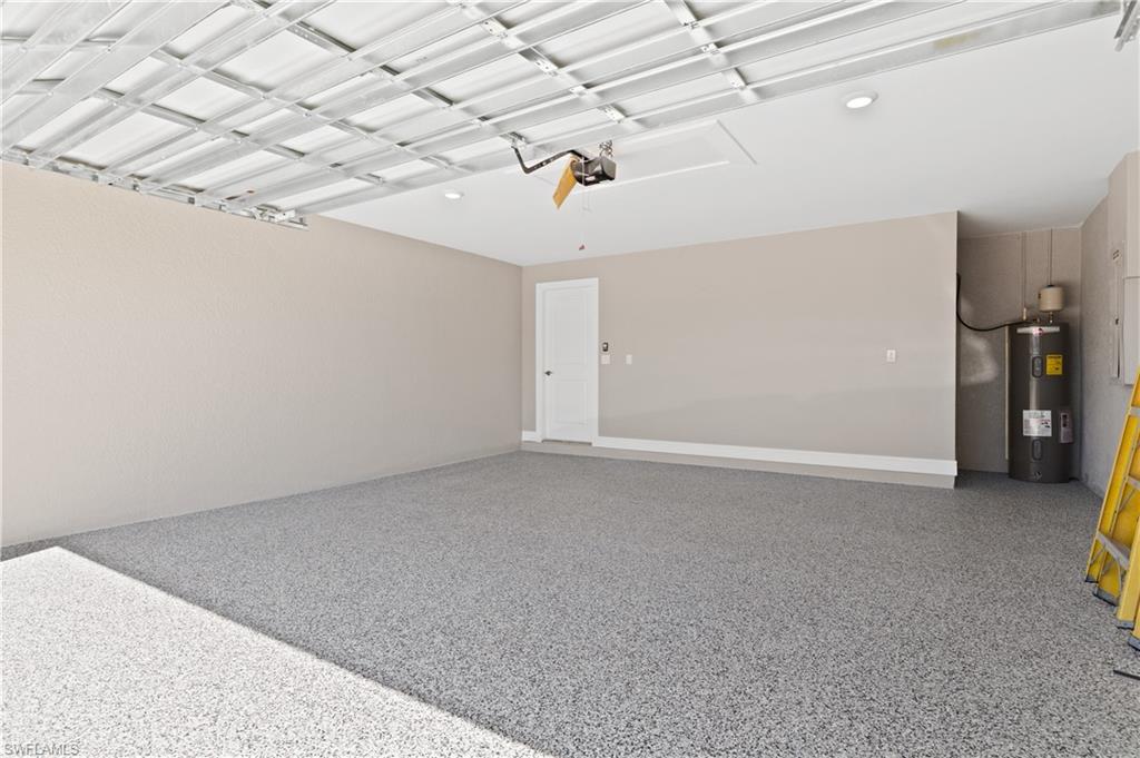 Garage featuring electric water heater