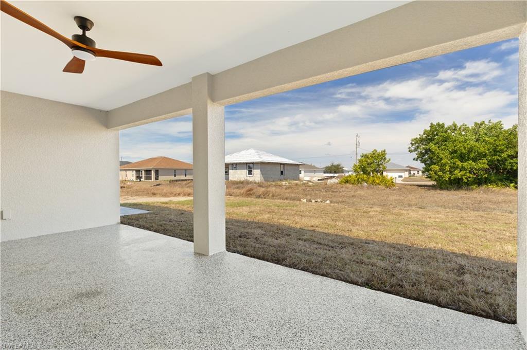 View of patio featuring ceiling fan