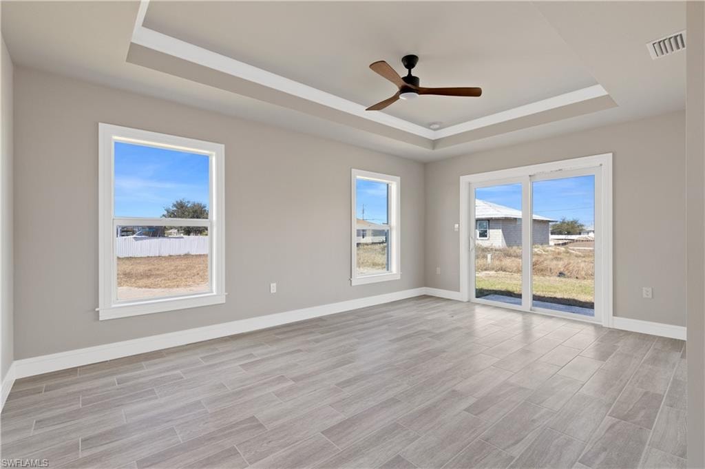 Empty room featuring wood tiled floors and ceiling fan