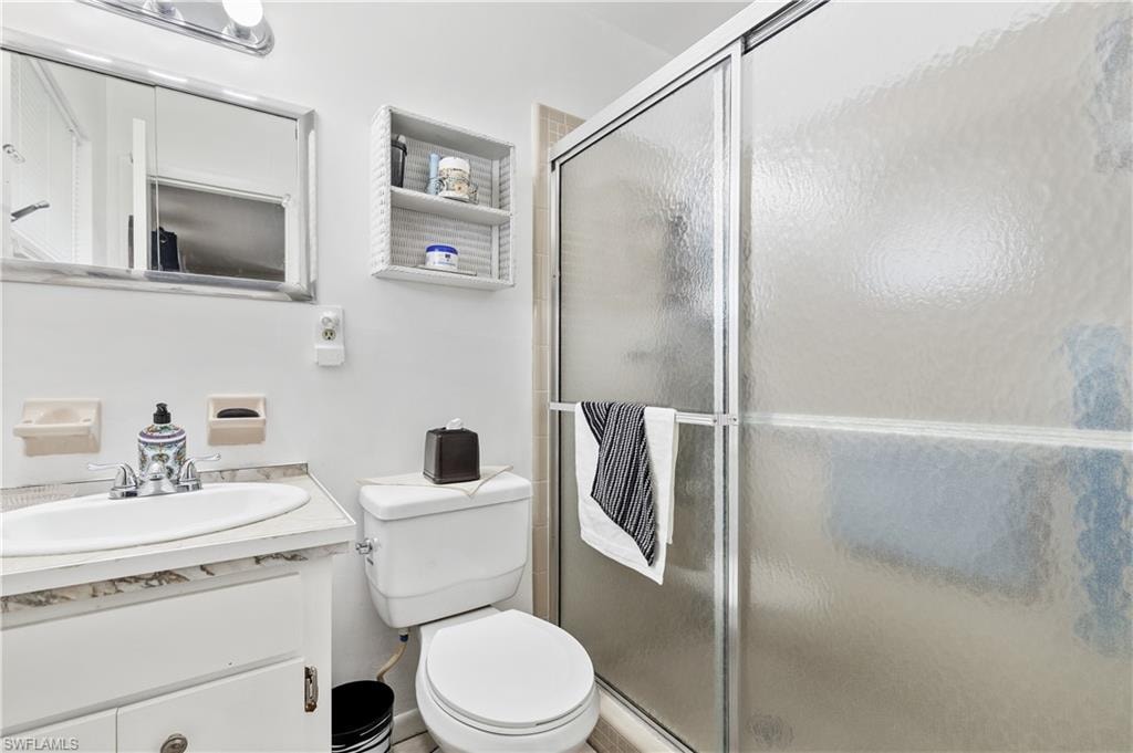 Bathroom featuring vanity and a stall shower