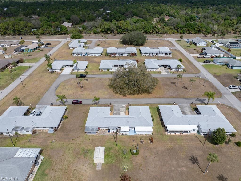 Aerial view of property's location with nearby suburban area