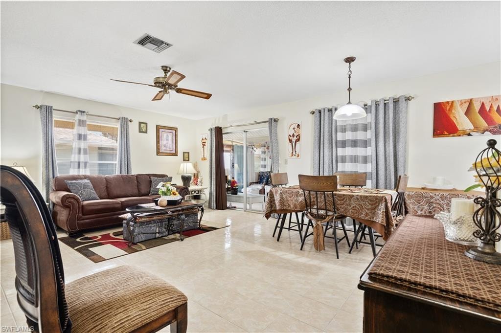 Living area featuring a ceiling fan