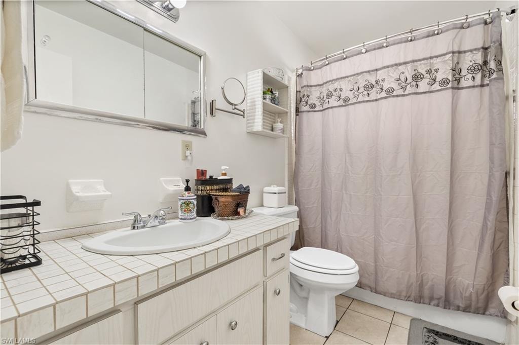 Bathroom featuring vanity and light tile patterned floors