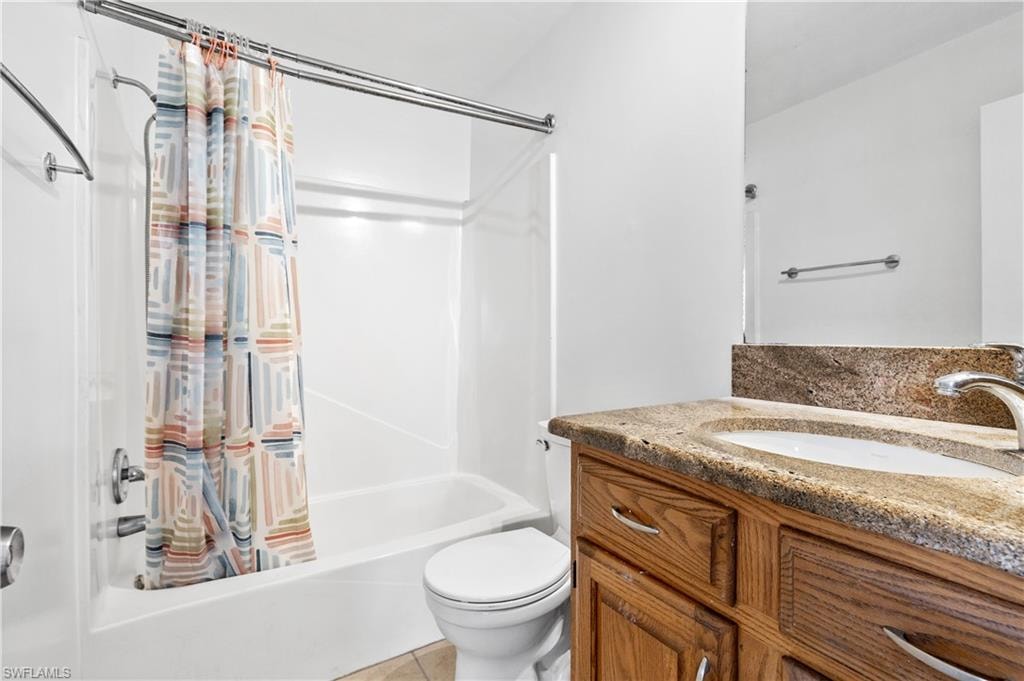 Bathroom featuring vanity and shower / tub combo