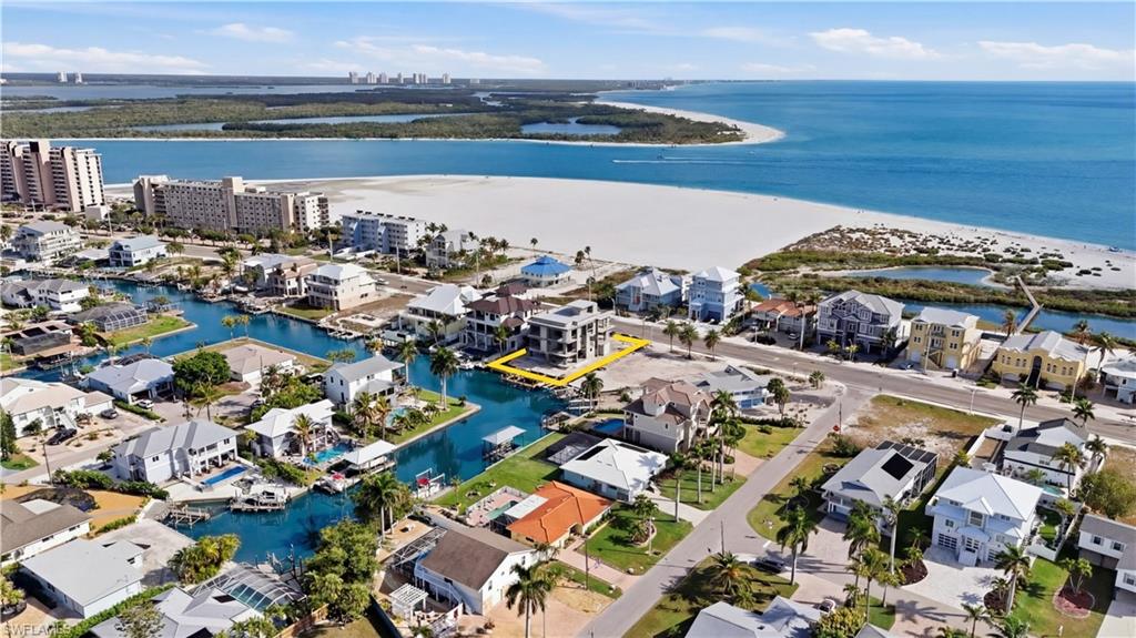 Aerial perspective of suburban area with a nearby body of water - Virtually Edited Image