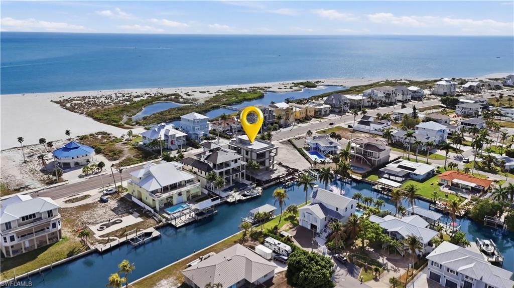 Aerial view of residential area featuring a nearby body of water - Virtually Edited Image