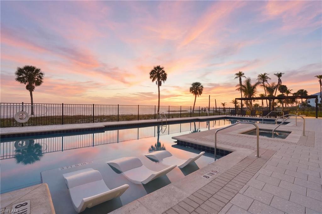 Pool at dusk with a community pool