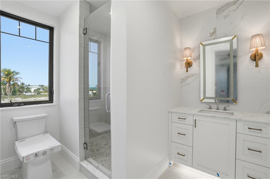 Bathroom with vanity and a shower stall