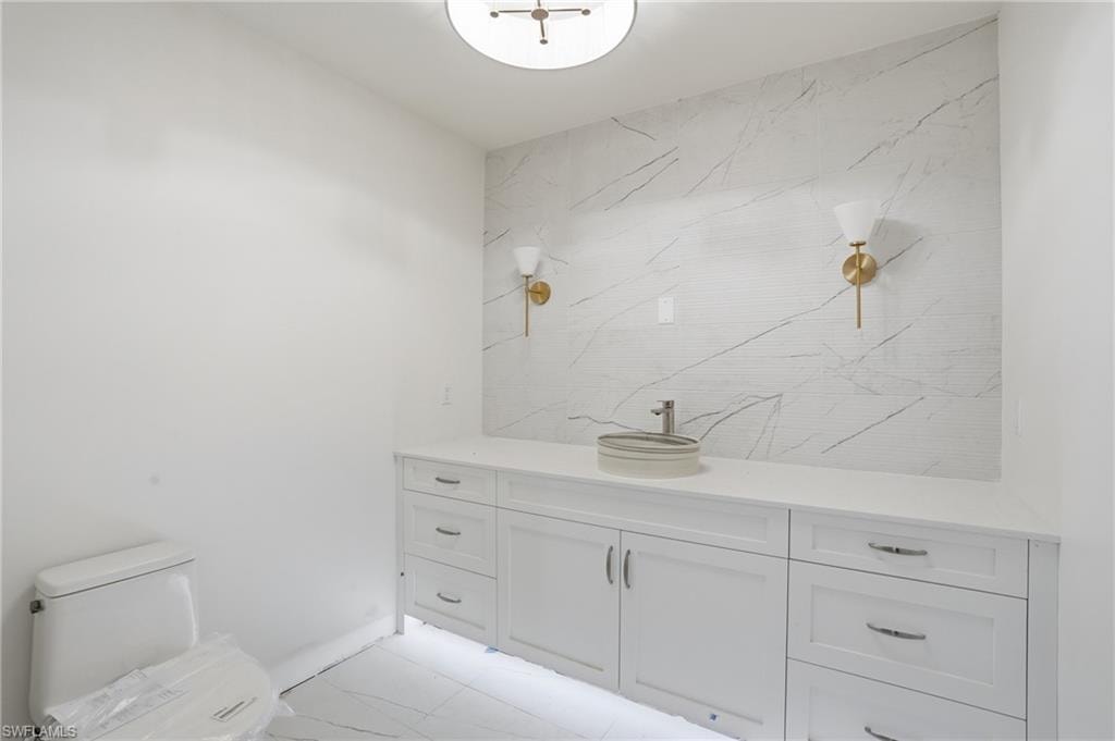 Bathroom featuring vanity and toilet