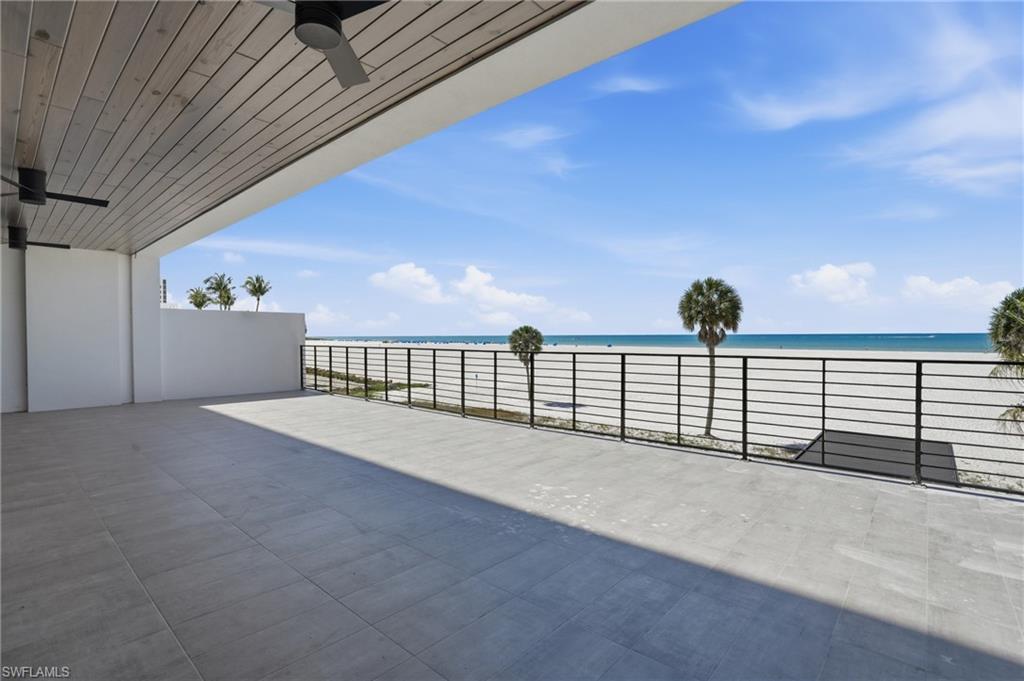 View of patio / terrace featuring a ceiling fan and a water view