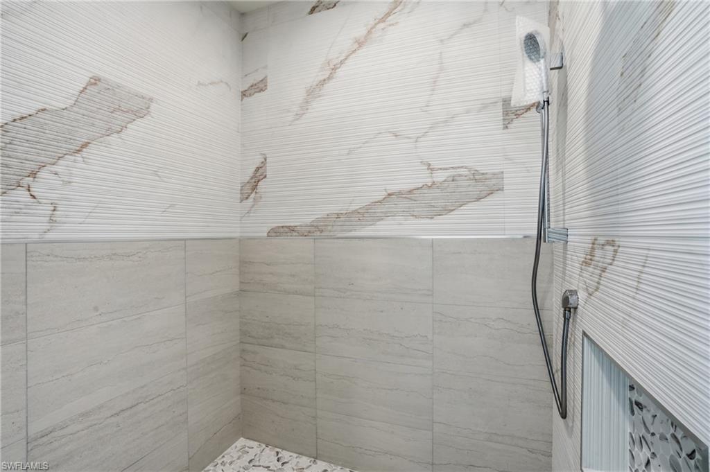 Bathroom featuring a tile shower