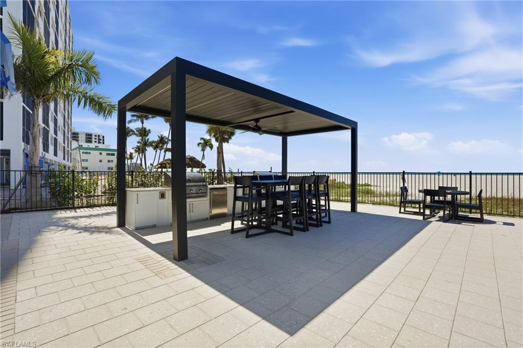 View of patio with an outdoor kitchen / dining area
