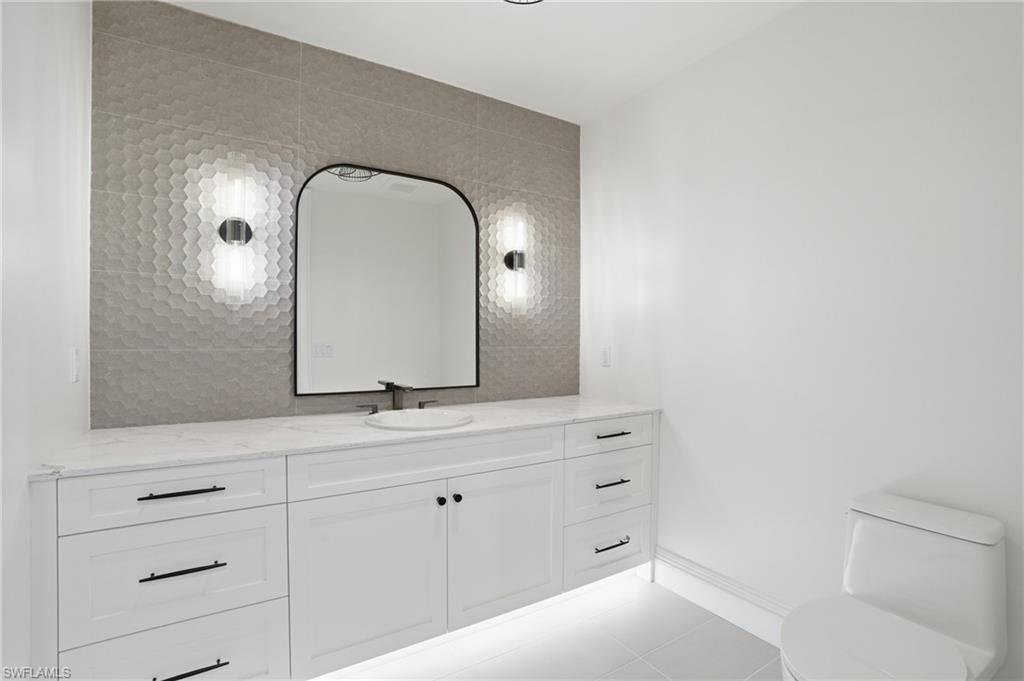 Bathroom featuring vanity and light tile patterned flooring