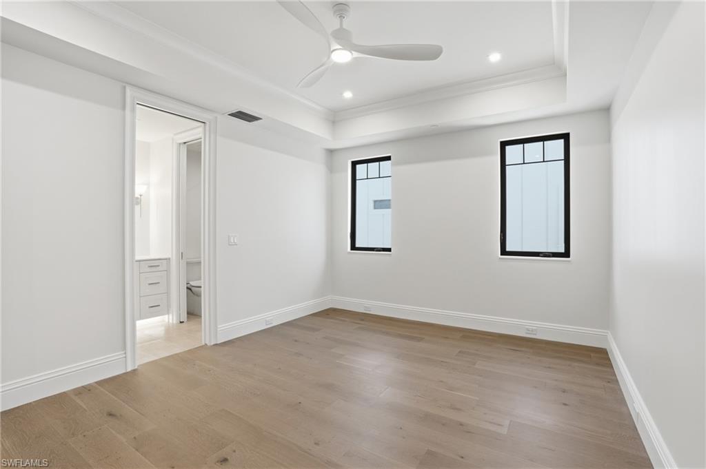 Unfurnished bedroom featuring light wood-style flooring, ornamental molding, ceiling fan, and recessed lighting