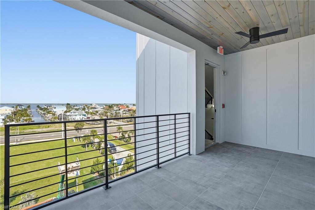 Balcony featuring ceiling fan