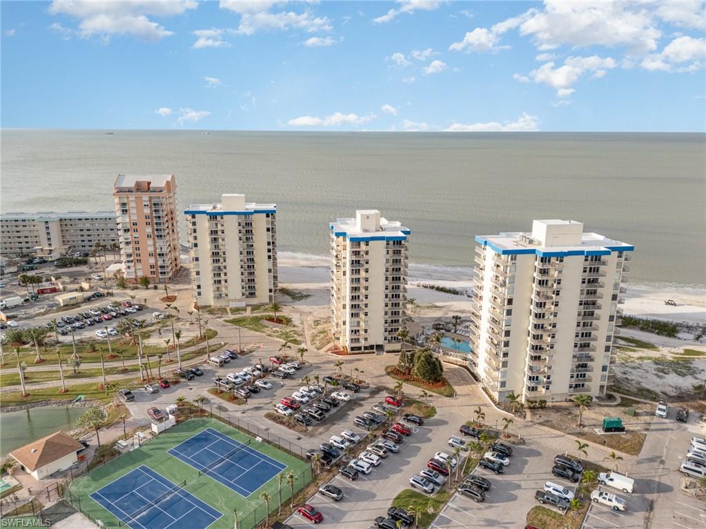 Aerial view of apartment complex / building and a nearby body of water