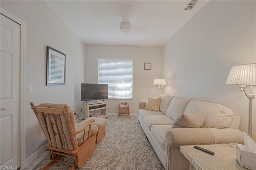 Den / Home office with window and closet with Sleeper couch could be 3rd bedroom for guests.