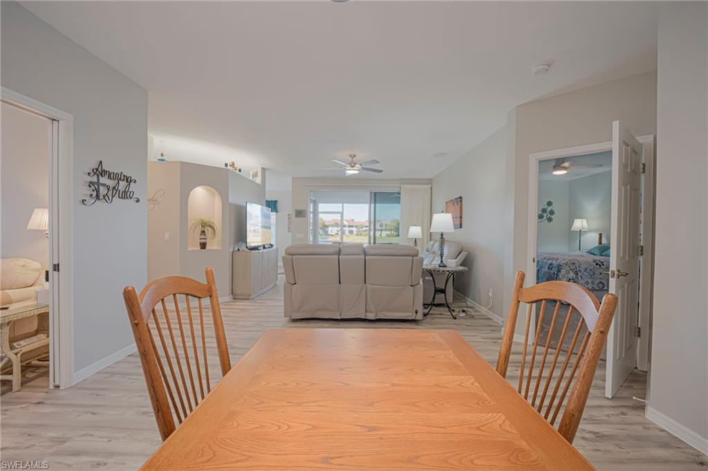 Dining space featuring light wood-style flooring and a ceiling fan