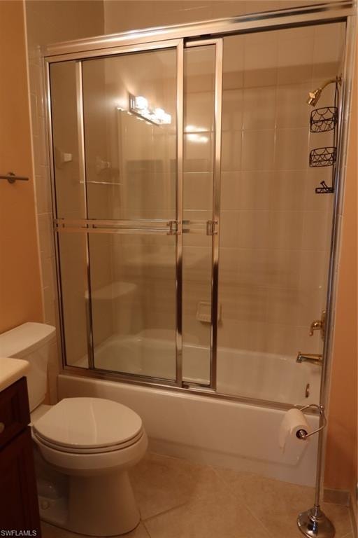 Bathroom featuring a shower-tub combination with sliding glass doors, white tiled walls, and a chrome showerhead