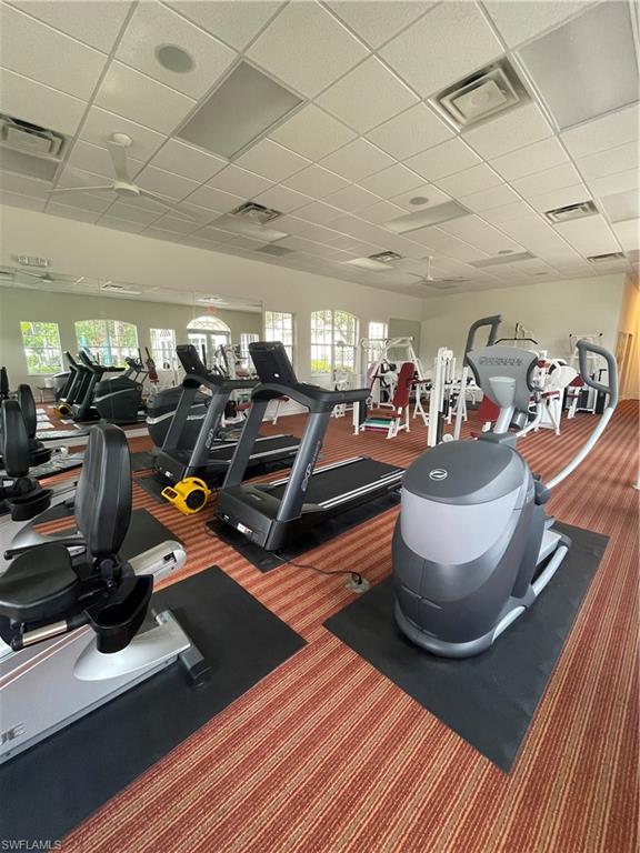 Gym with a paneled ceiling
