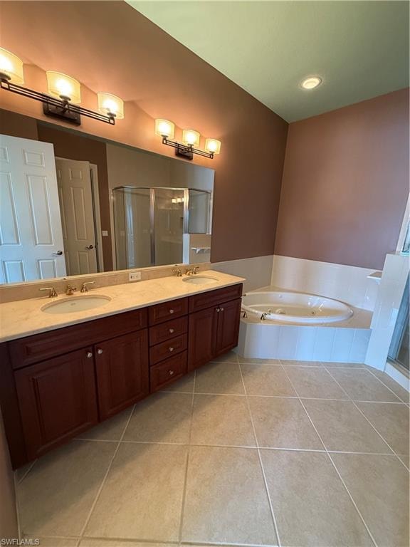 Full bath featuring double vanity, a shower stall, light tile patterned floors, and a bath