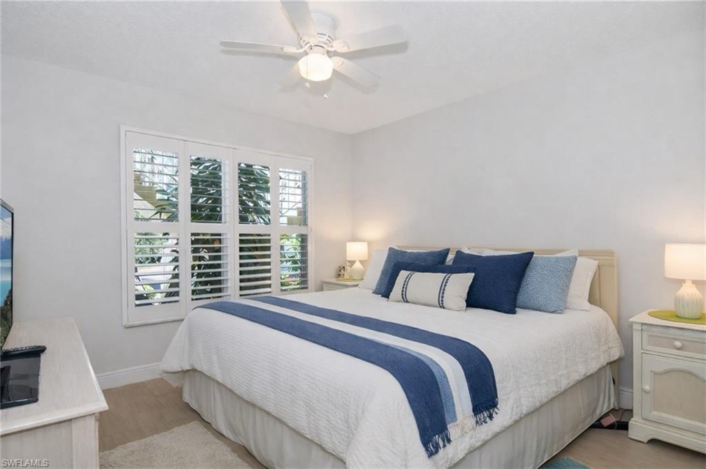 Bedroom with light wood-style floors and ceiling fan