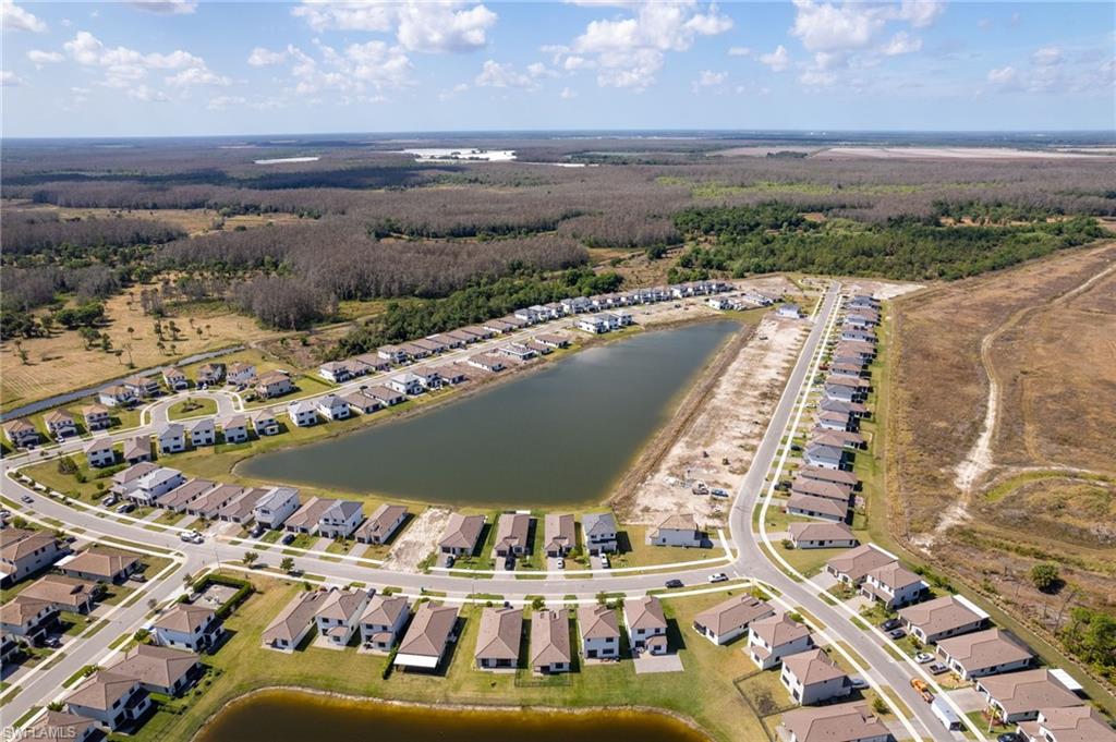 View of property location featuring nearby suburban area and a large body of water