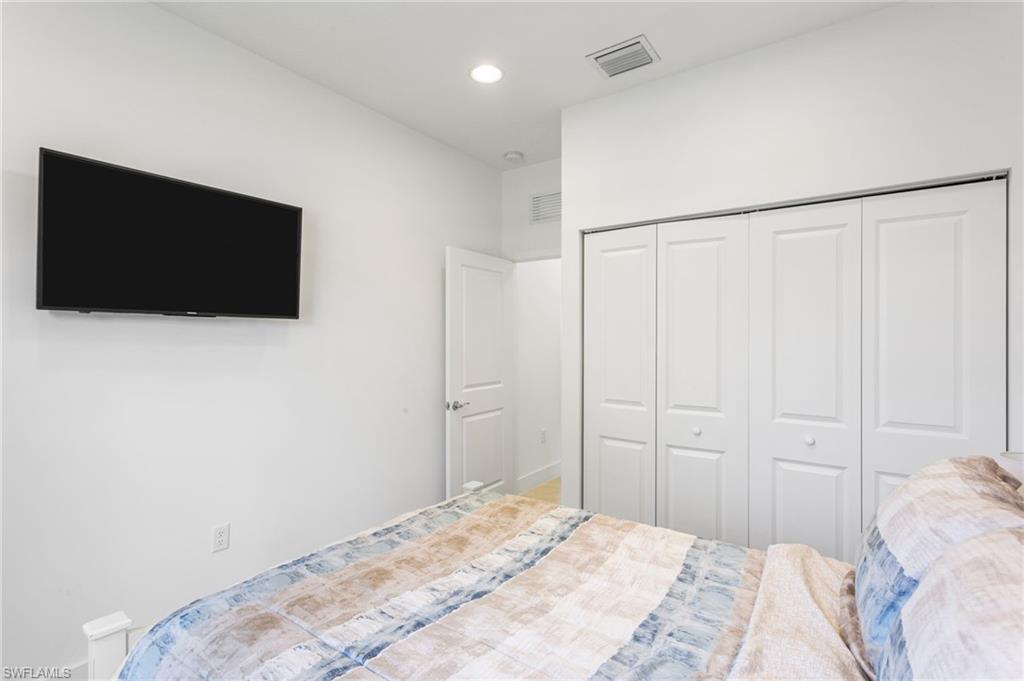 Bedroom with a closet and recessed lighting