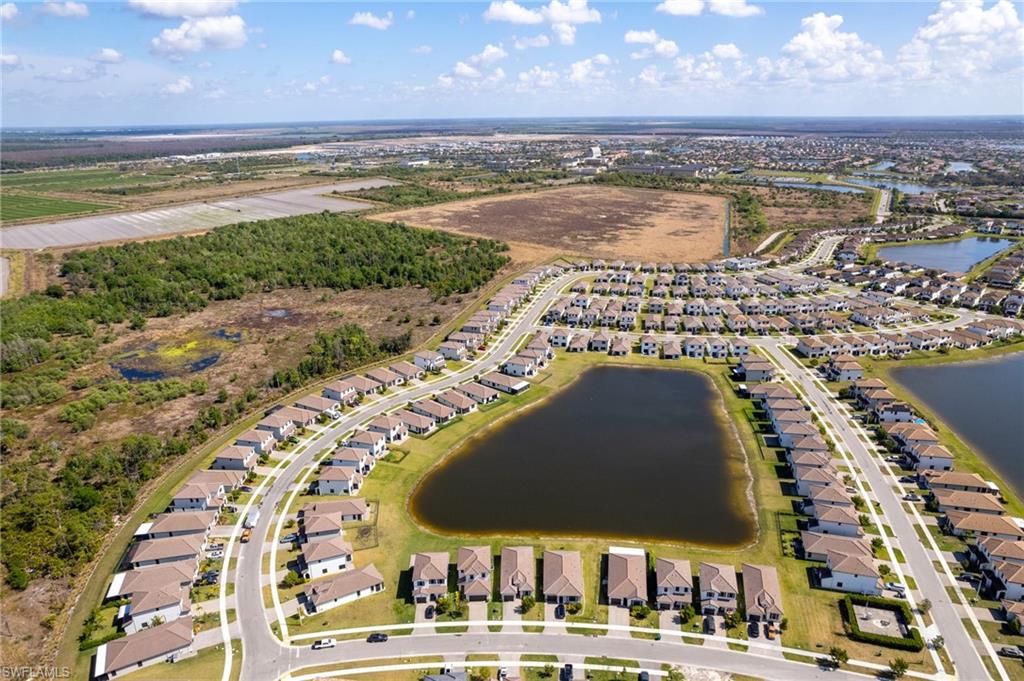 View of property location featuring nearby suburban area and a large body of water