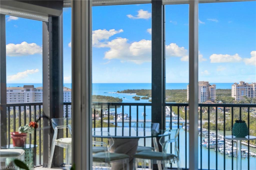 Sunroom featuring a water view and healthy amount of natural light