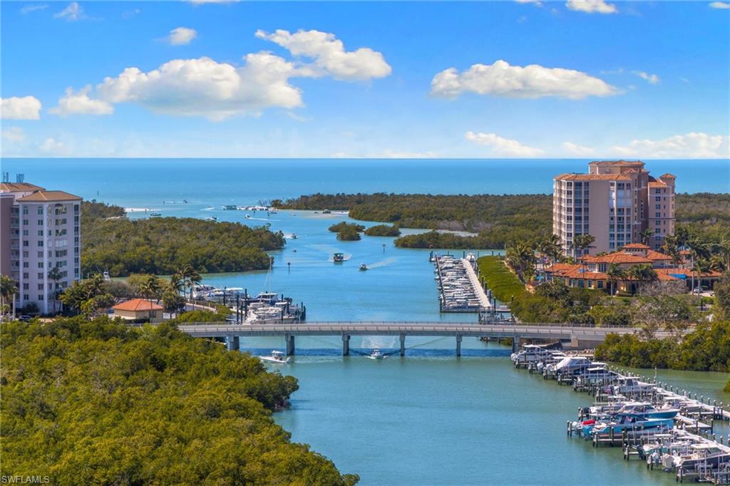 Bird's eye view of a large body of water and a notable bridge