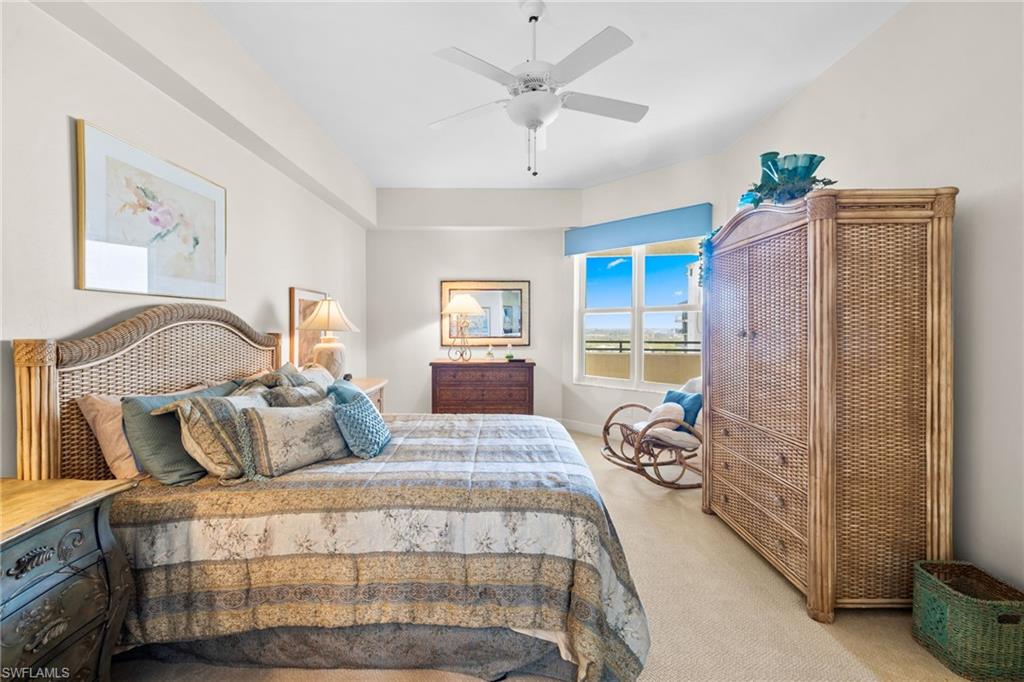 Bedroom featuring light carpet and ceiling fan
