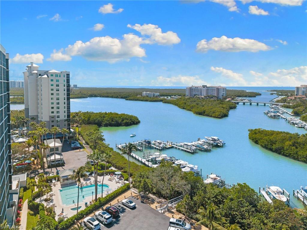 View of urban area featuring a large body of water and numerous boat docks
