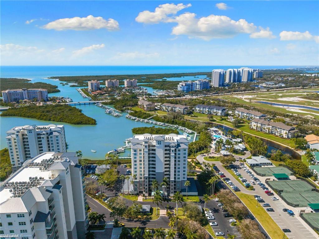 View of urban area featuring a large body of water and apartment complex / building