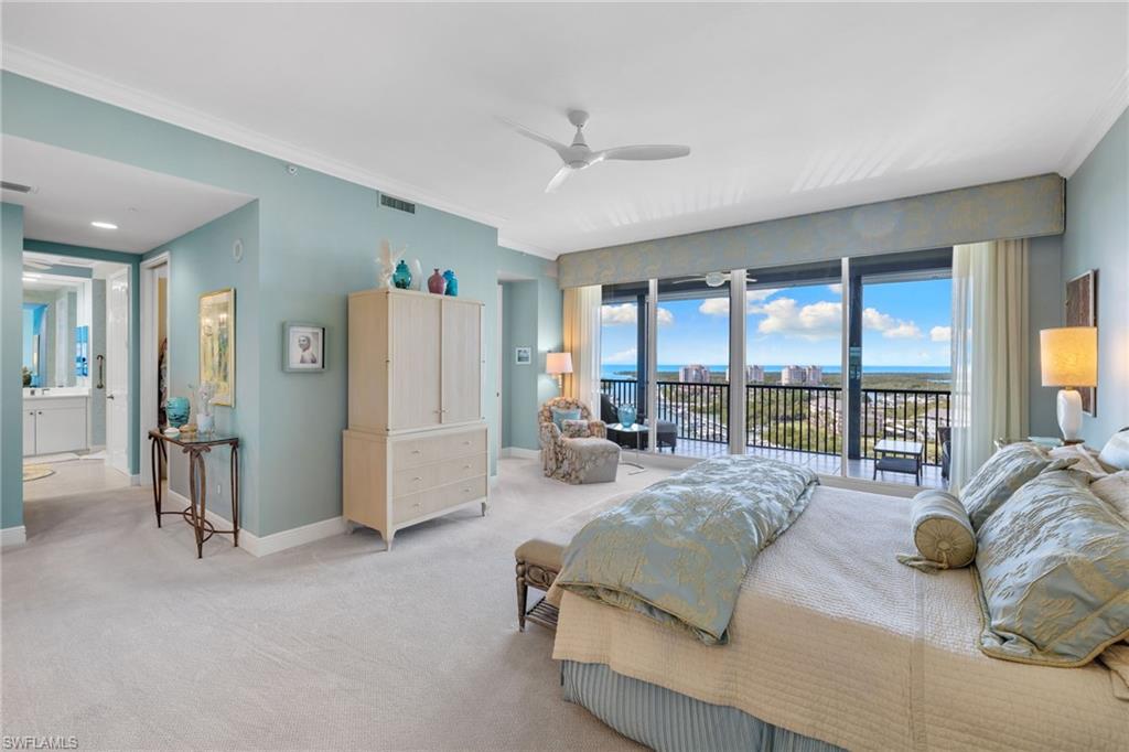 Carpeted bedroom featuring ornamental molding, access to exterior, and a ceiling fan