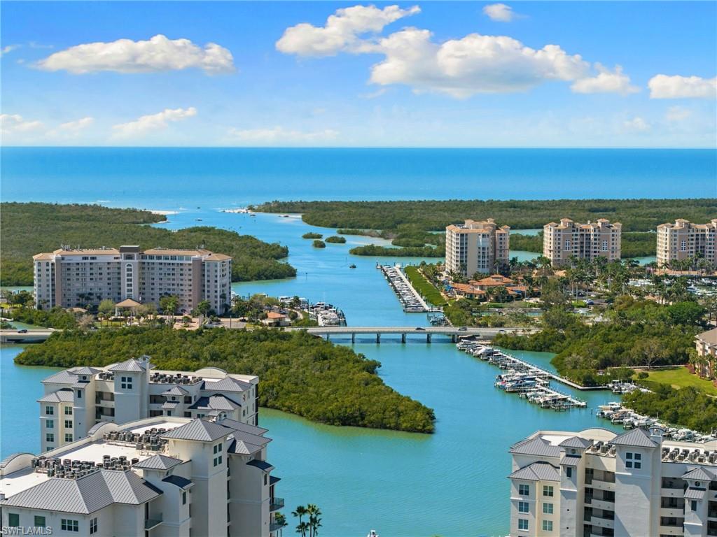 Aerial view of a nearby body of water and numerous boat docks