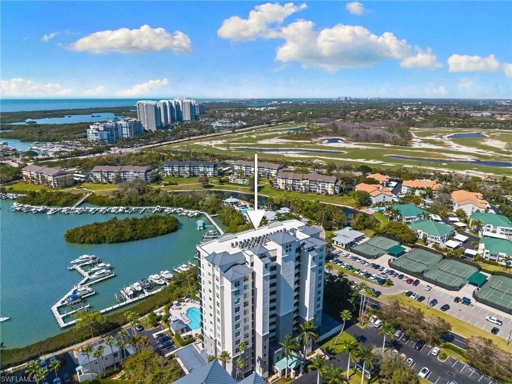 View of urban area featuring a large body of water and apartment complex / building