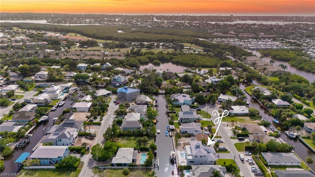 Aerial at Sunset w/ Naples Bay & Gulf in Background