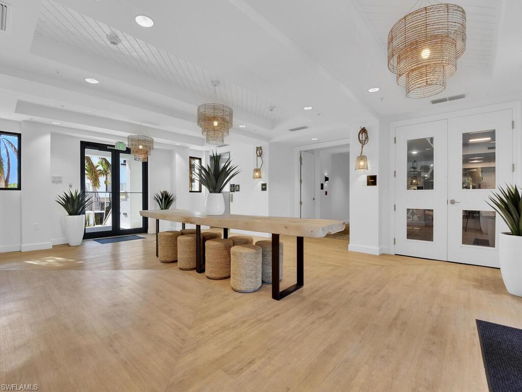 Kitchen with french doors, pendant lighting, and a wood tray ceiling