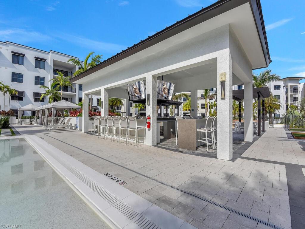 View of home's community with an outdoor bar, a patio, and a gazebo