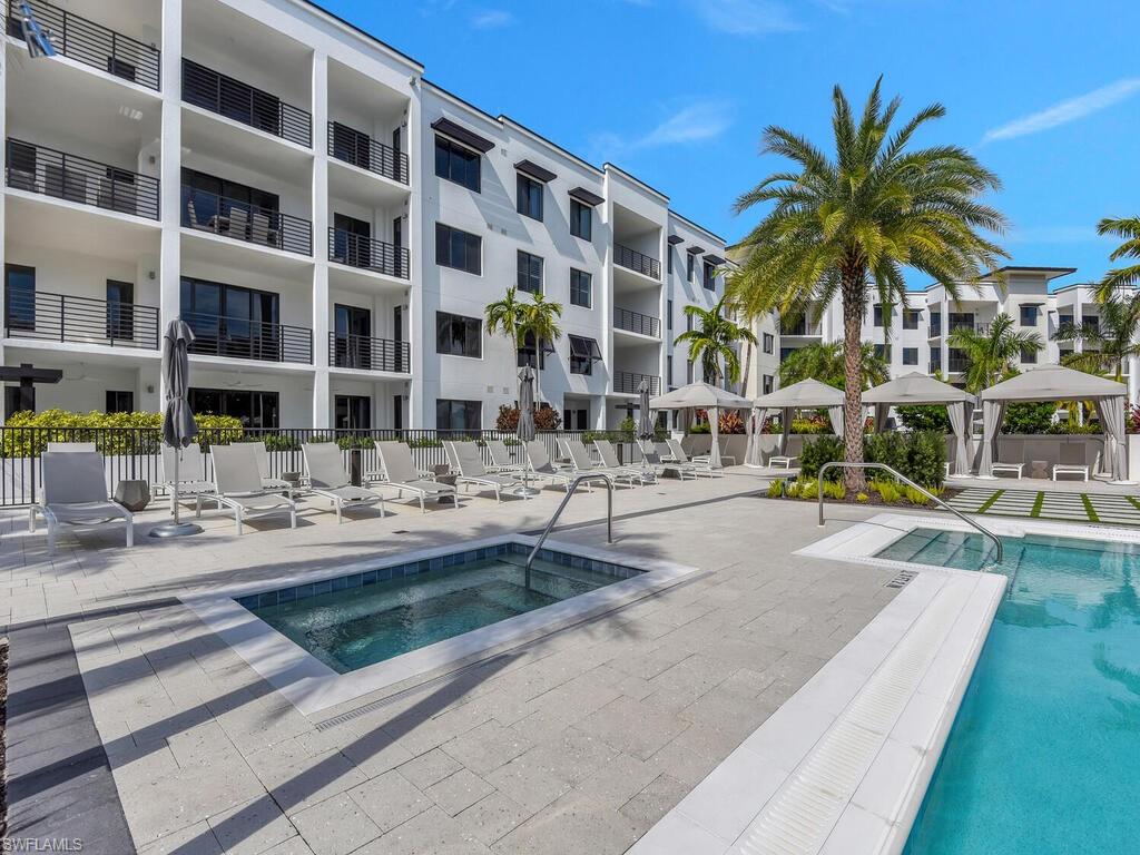 Community pool featuring a gazebo, a community hot tub, and a patio area