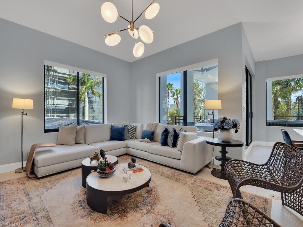 Living area featuring healthy amount of natural light and suspended lighting