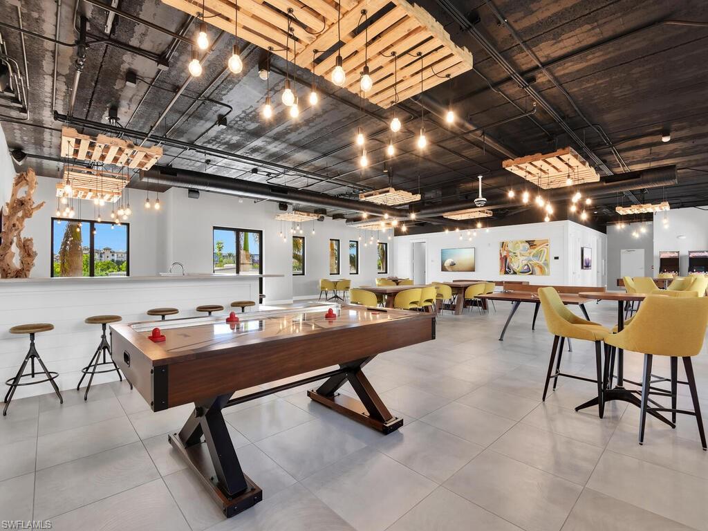 Game room with a high ceiling