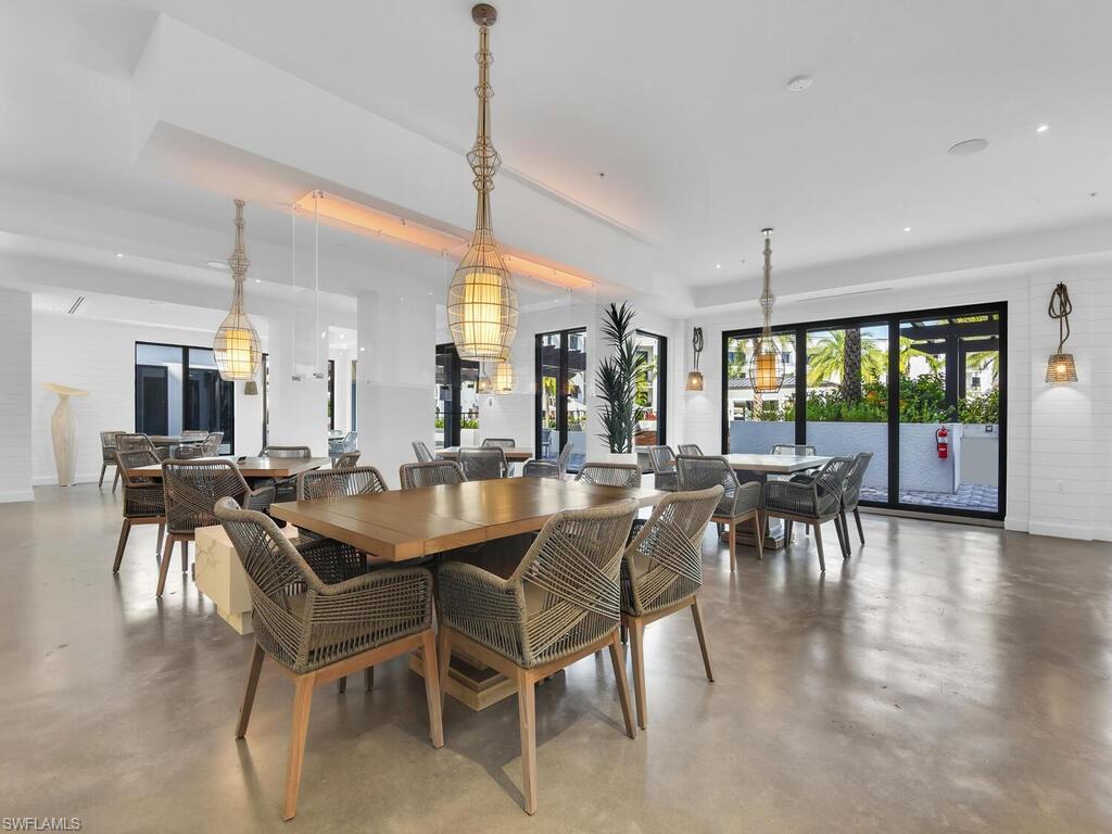 Dining space featuring finished concrete flooring and recessed lighting