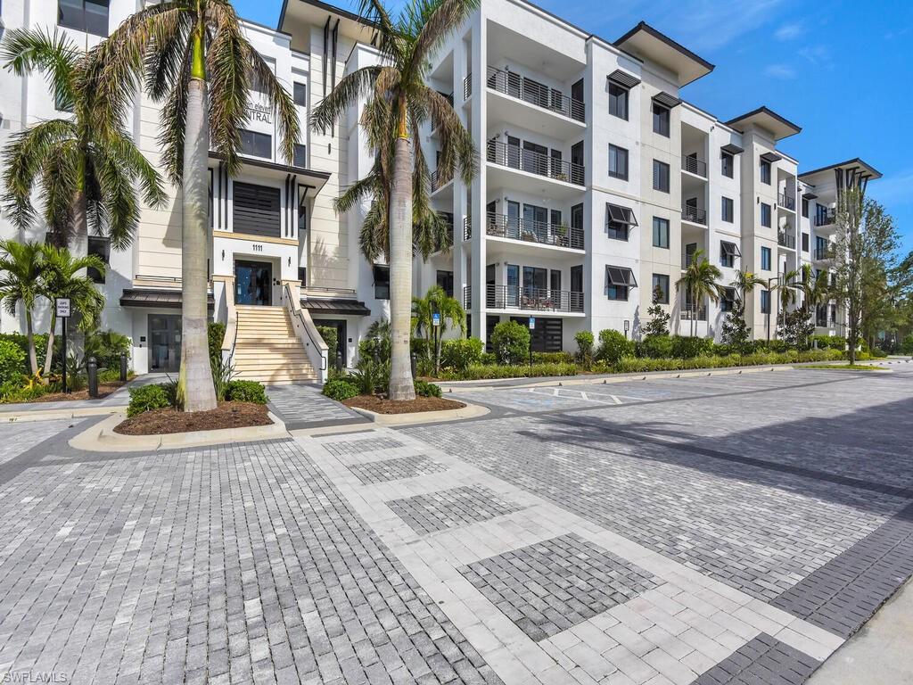 View of apartment building / complex featuring stairs