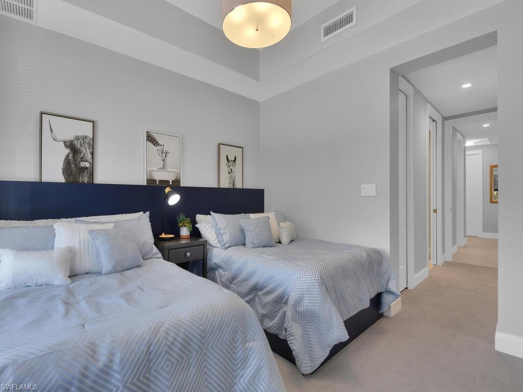 Carpeted bedroom featuring baseboards and recessed lighting