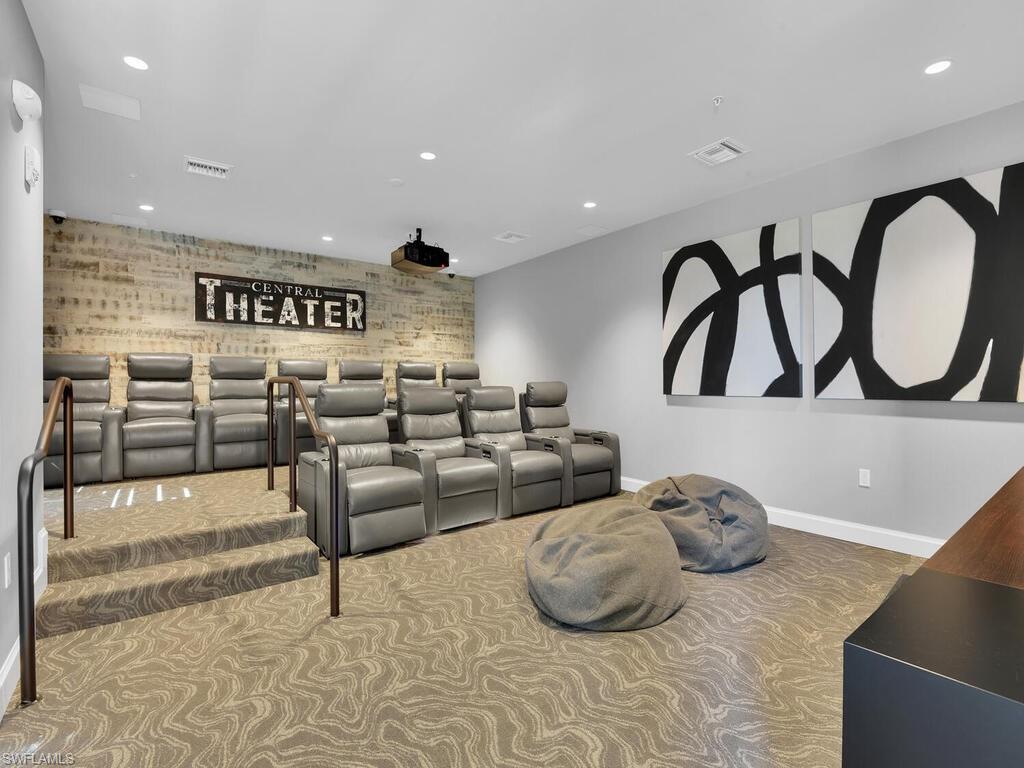 Carpeted home theater room featuring baseboards and recessed lighting