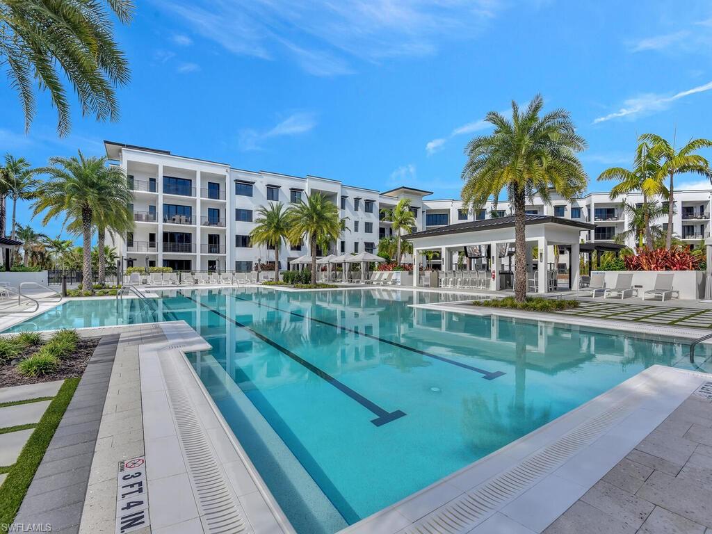 Community pool with a patio